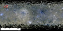 Surface of dwarf planet Ceres. The sites of organic material are shown as or in red boxes. The vast majority of sites are found near the Ernutet crater in the northern hemisphere.